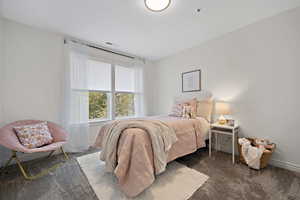Bedroom featuring carpet, visible vents, and baseboards