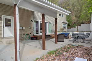 View of patio featuring an outdoor living space and entry steps