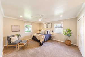 Bedroom with baseboards and carpet