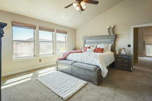 Bedroom with ceiling fan, visible vents, vaulted ceiling, carpet floors, and baseboards