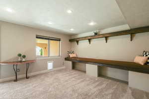 Basement featuring baseboards, carpet flooring, and recessed lighting