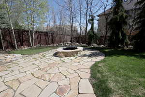 View of patio / terrace with a fenced backyard and an outdoor fire pit
