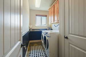 Laundry room featuring cabinet space and washer and dryer