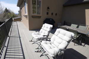 Deck with an outdoor hangout area and outdoor dining space