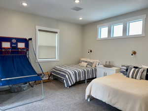 Bedroom with carpet flooring, and recessed lighting
