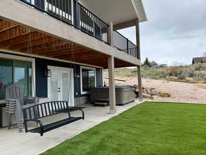 Exterior space with a hot tub