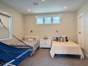 Carpeted bedroom featuring recessed lighting