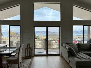 Doorway featuring wood walls, a mountain view, and wood finished floors