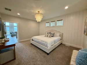 Bedroom with recessed lighting, baseboards, and a chandelier