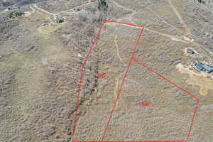 Aerial view featuring a rural view and a desert view