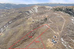 Birds eye view of property with a rural view and a mountain view