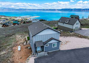 Aerial view featuring a water and mountain view