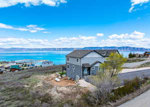 Drone / aerial view with a water and mountain view
