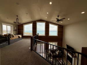 Corridor featuring recessed lighting, carpet floors, vaulted ceiling, and an upstairs landing