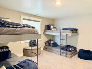 Bedroom featuring carpet floors, baseboards