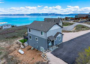 Aerial view featuring a water and mountain view