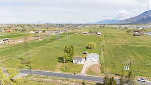 Drone / aerial view with a mountain view and a rural view