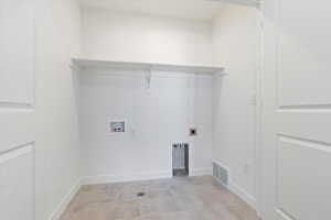 Laundry room featuring laundry area, electric dryer hookup, visible vents, baseboards, and hookup for a washing machine