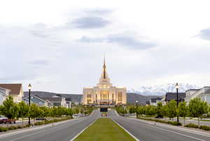 View of road featuring street lighting, a mountain view, and a residential view