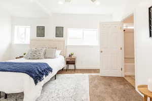 Bedroom featuring recessed lighting, carpet flooring, and multiple windows
