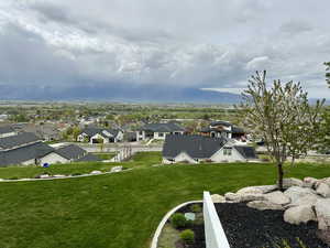View of yard featuring an amazing mountain view and a residential view