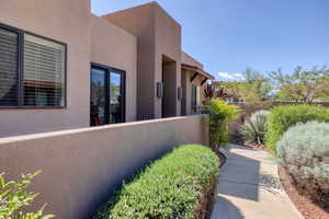 View of home's exterior featuring fence and stucco siding