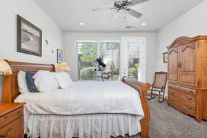 Bedroom featuring visible vents, carpet, recessed lighting, and access to exterior