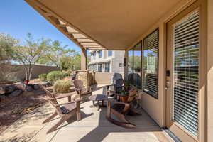 View of patio with fence