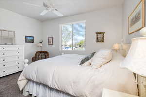Bedroom with carpet and ceiling fan