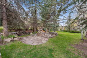 View of yard with a patio