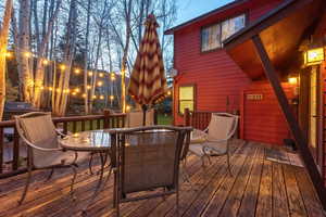 Wooden terrace featuring outdoor dining area