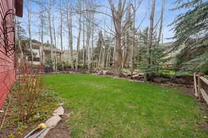 View of yard featuring fence