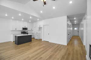 Kitchen featuring ceiling fan, appliances with stainless steel finishes, light countertops, recessed lighting, and white cabinetry