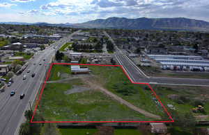 Birds eye view of property with a mountain view and a residential view
