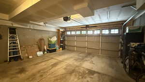 Garage featuring a garage door opener