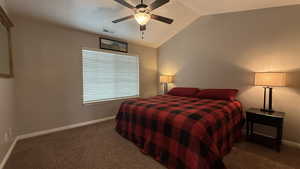 Bedroom with ceiling fan, carpet flooring, baseboards, visible vents, and lofted ceiling
