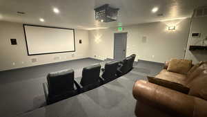 CLUB HOUSE: Home theater featuring baseboards, visible vents, and recessed lighting