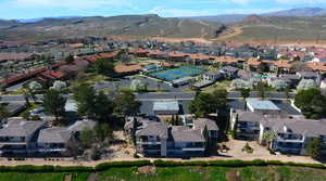 Drone / aerial view with a residential view and a mountain view