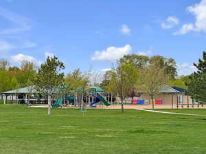 Community play area with a lawn and a gazebo