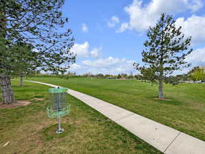 View of property's community featuring a lawn