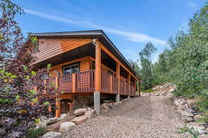 View of home's exterior featuring log veneer siding