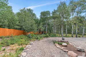 View of yard featuring fence