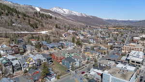 Drone / aerial view with a residential view and a mountain view