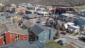 Birds eye view of property with a residential view and a mountain view