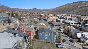 Birds eye view of property featuring a mountain view and a residential view