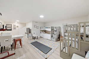 Interior space featuring visible vents, recessed lighting, and wood finished floors
