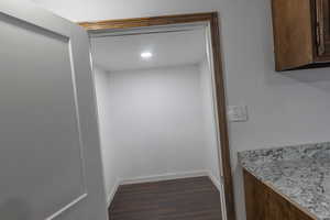 Interior details featuring baseboards and wood finished floors