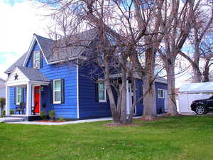 3rd view of front yard and carport. Red door is 1-bed Unit - White door is 3 bed unit.