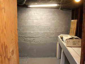 View of small workshop room in unfinished basement perfect for tool storage and plenty of other storage in White Door unit 2.