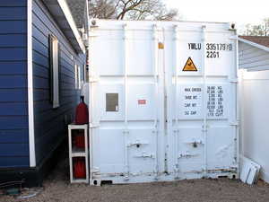 Painted shipping container along the west side of the property.  The container is 20 feet long and 8 feet wide.  Plenty of storage!